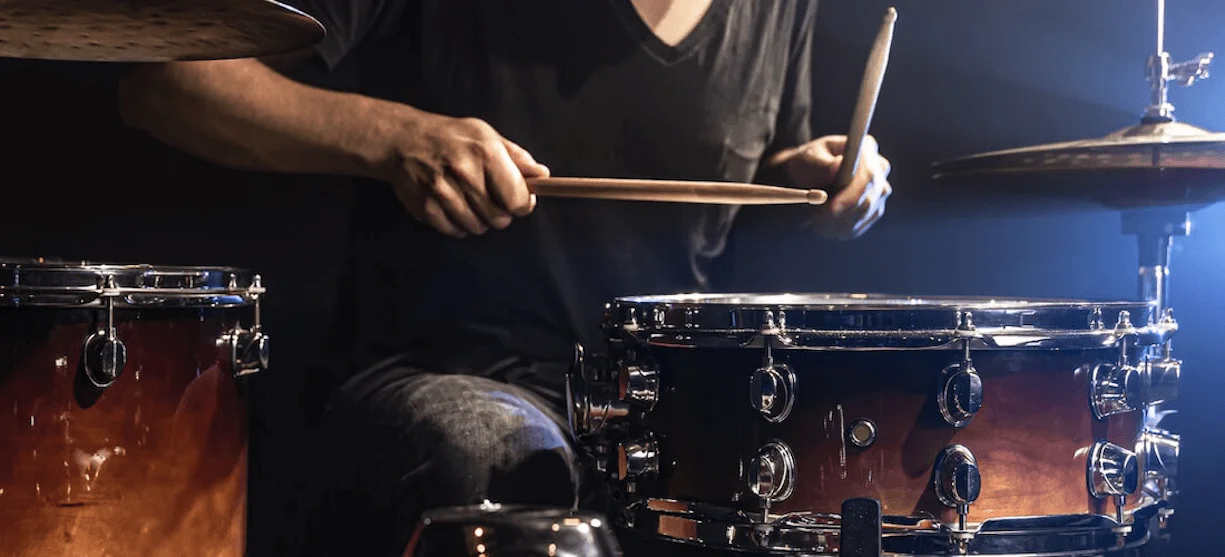 drummer practicing on a drum set