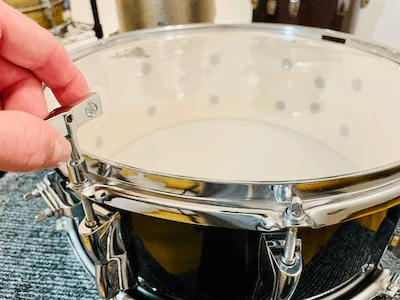 tightening snare side drum head