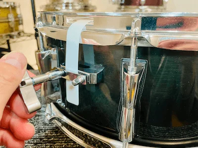 loosening bolts on snare butt plate