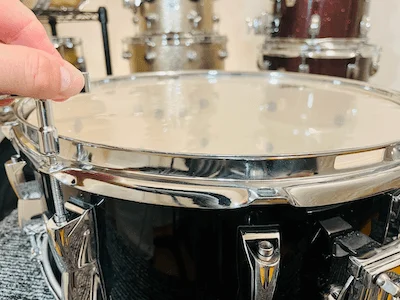 removing tension rods from snare drum