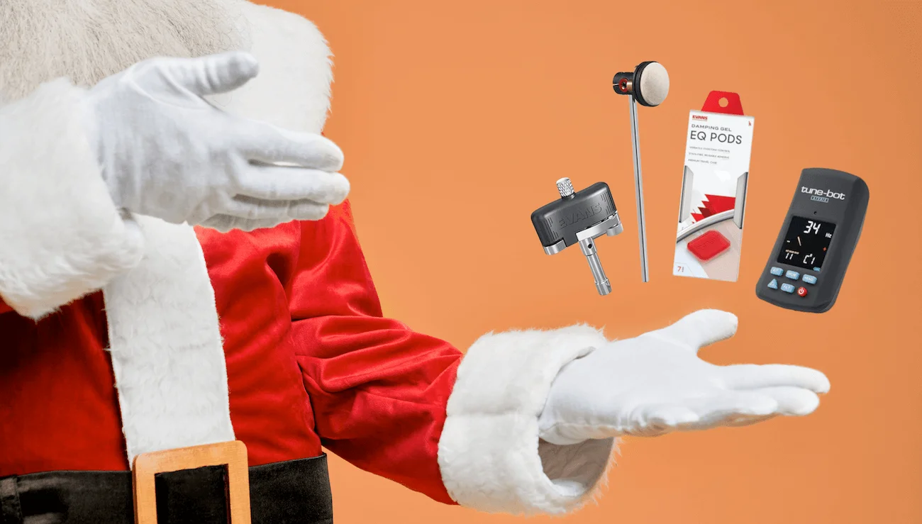 Santa holding drummer gifts